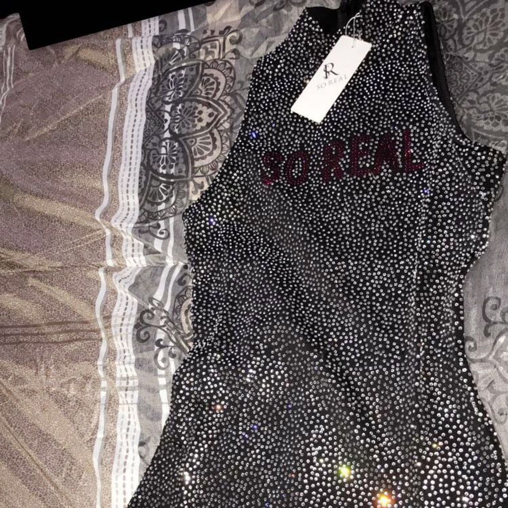 So real body suit size small never worn
